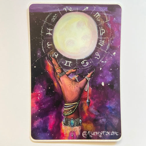 Square art sticker with image of a hand with long nails, jewelry, and tattoos reaching up towards the moon that is surrounded by symbols of the zodiac. Behind the hand and moon the background is a pink galaxy with stars.
