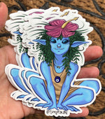 Load image into Gallery viewer, A hand holding a stack of blue elf-nymph FunkyFae art stickers.
